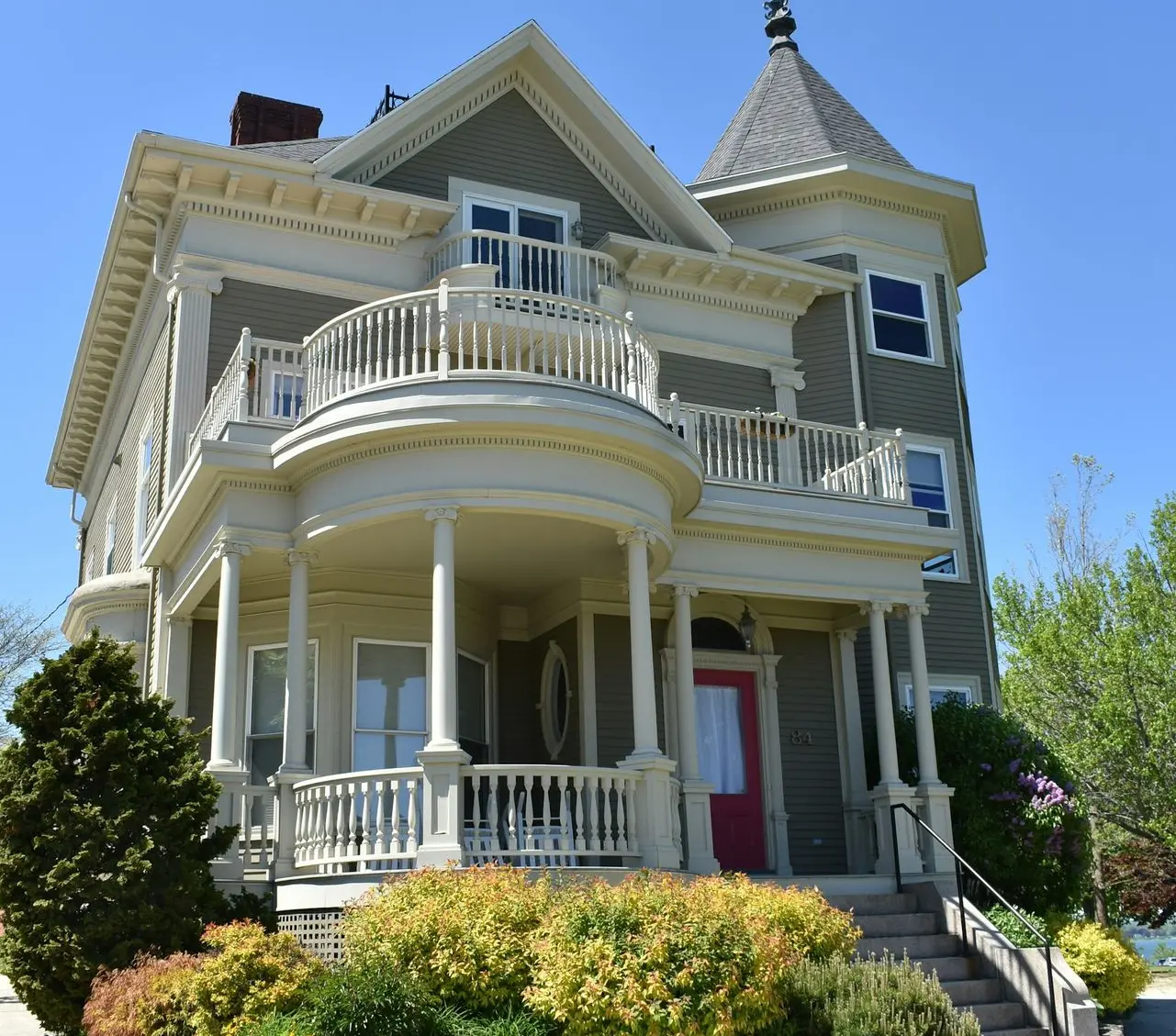 white and gray wooden 2-storey house